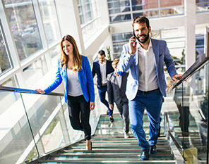 296x223-ca-business-people-walking-up-stairs-cauc